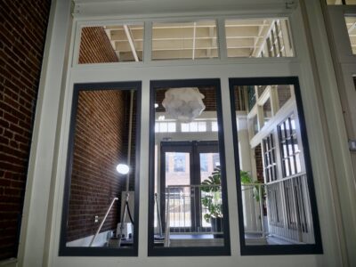 Industry Urban Loft Studios with High Ceilings, Skylights, Grey Hardwood Floors